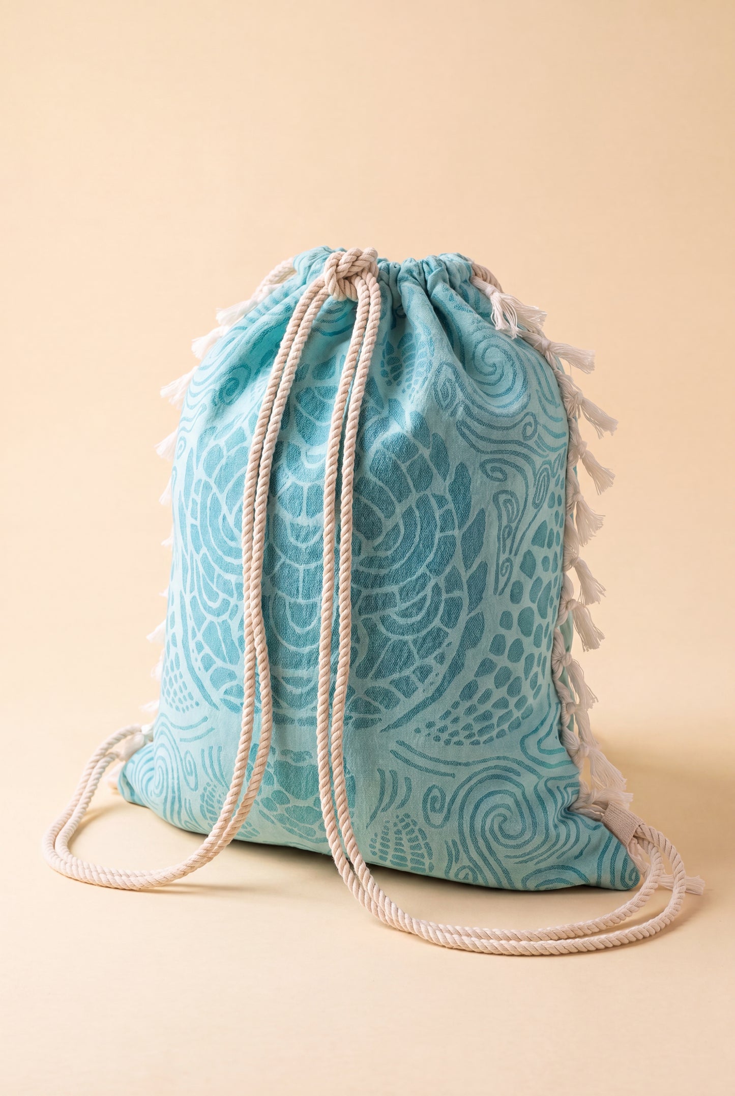 Wears hands-free as a drawstring backpack