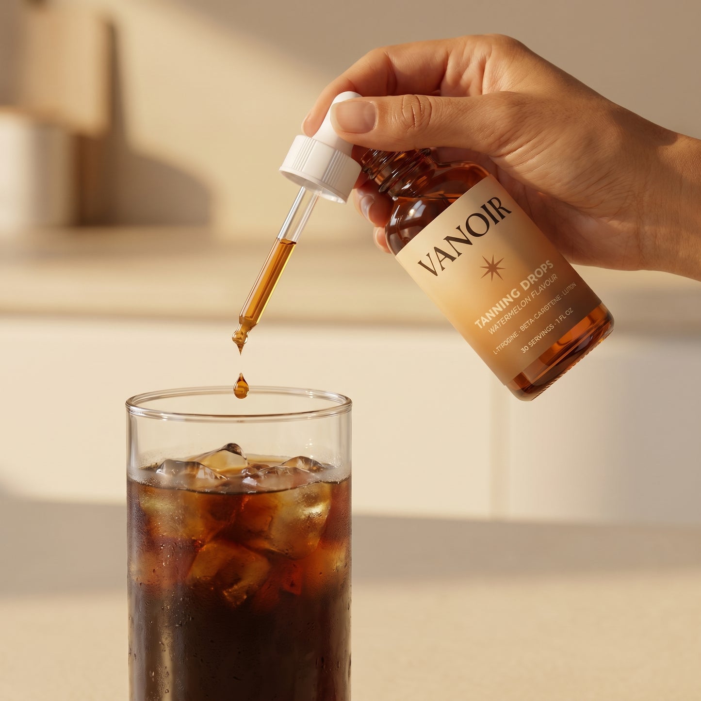 Adding drops to iced coffee