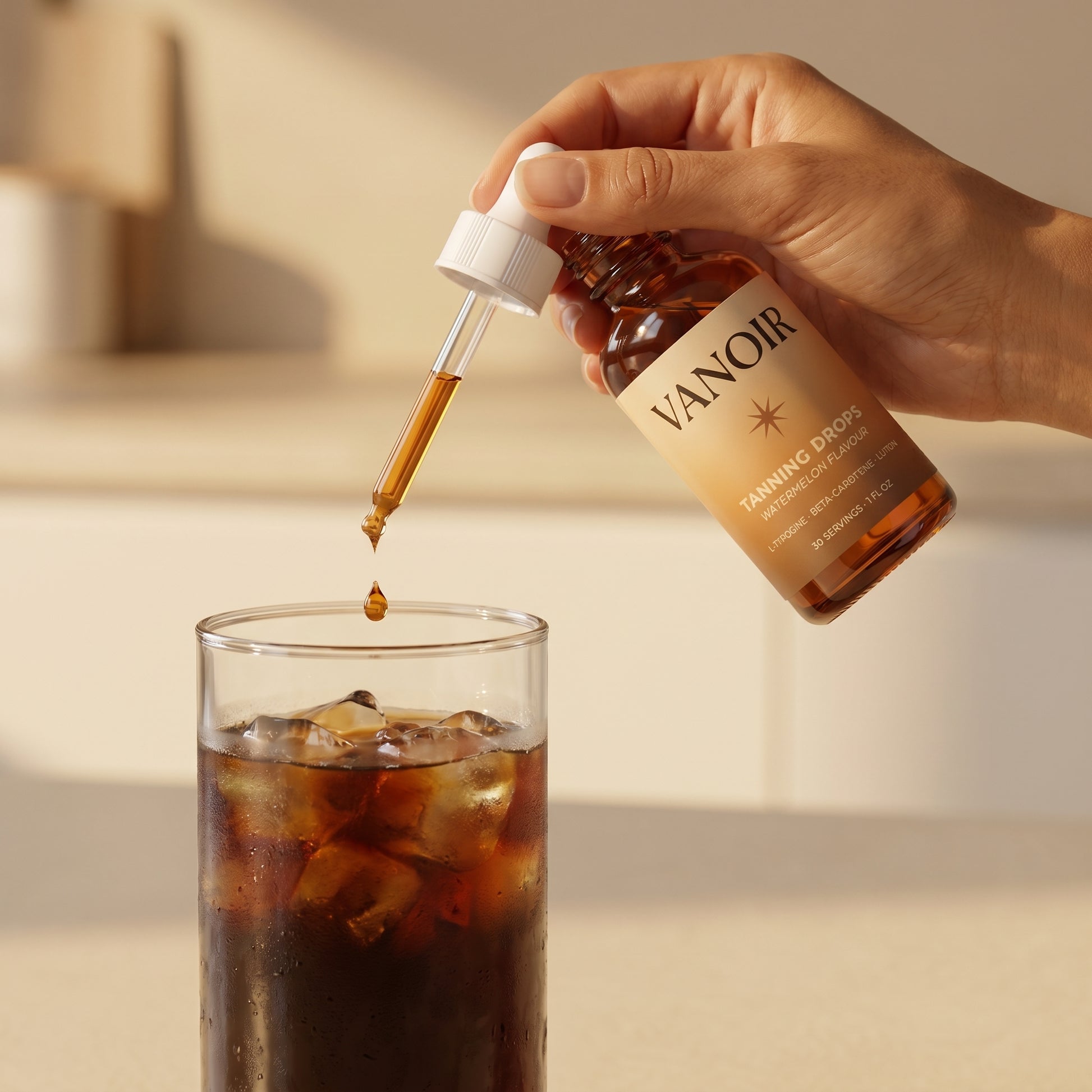 Adding drops to iced coffee