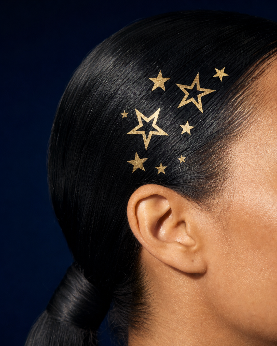Gold stars on jet black hair