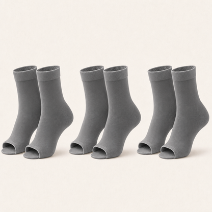 3 pairs of plain open-toe ankle compression socks in grey, standing upright