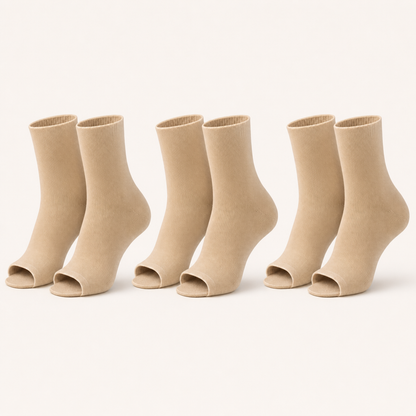 3 pairs of plain open-toe ankle compression socks in nude, standing upright