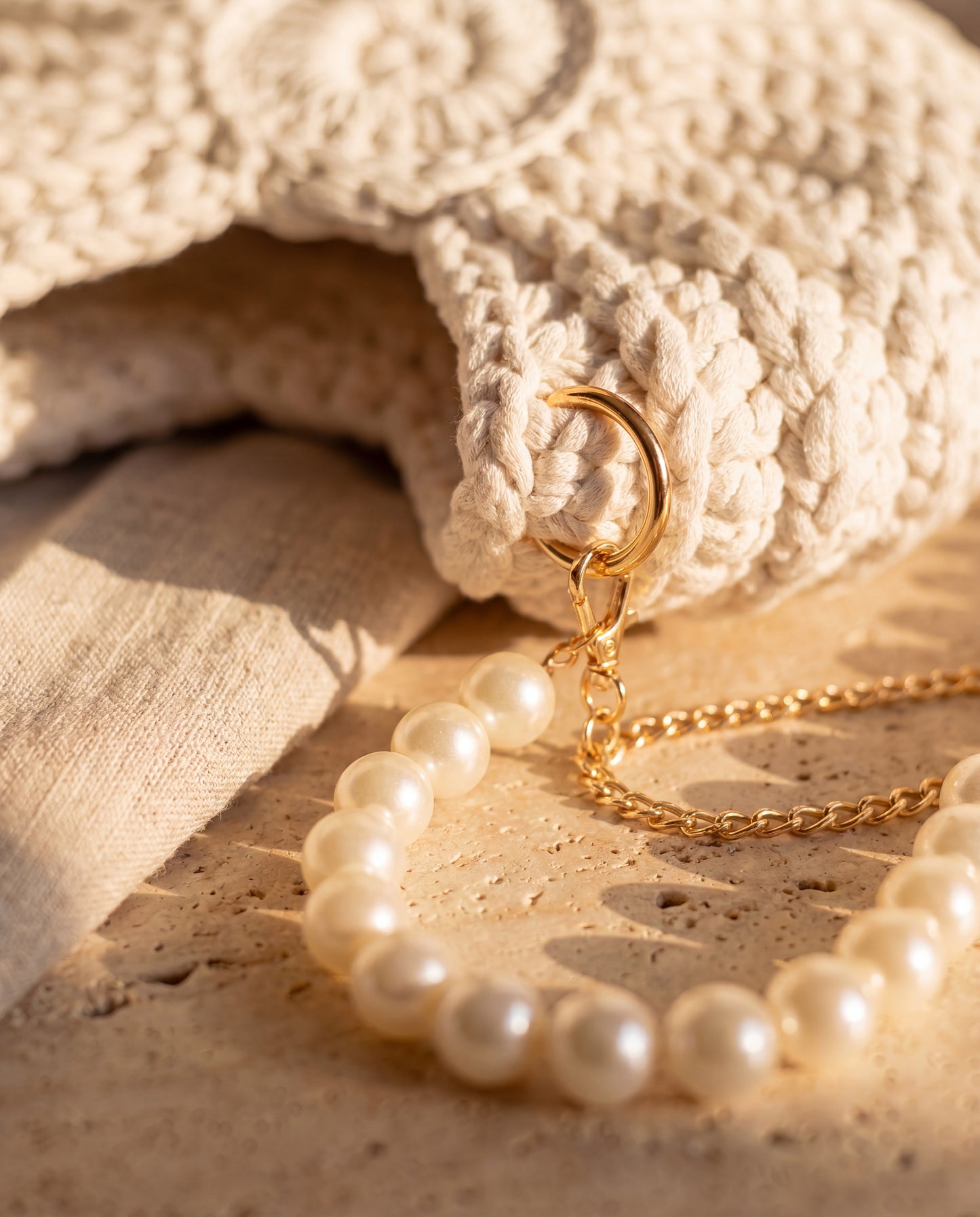 Pearl-and-gold strap detail