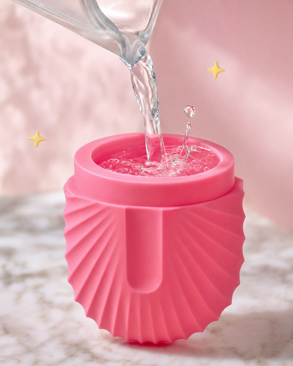 Water pouring into silicone mold macro