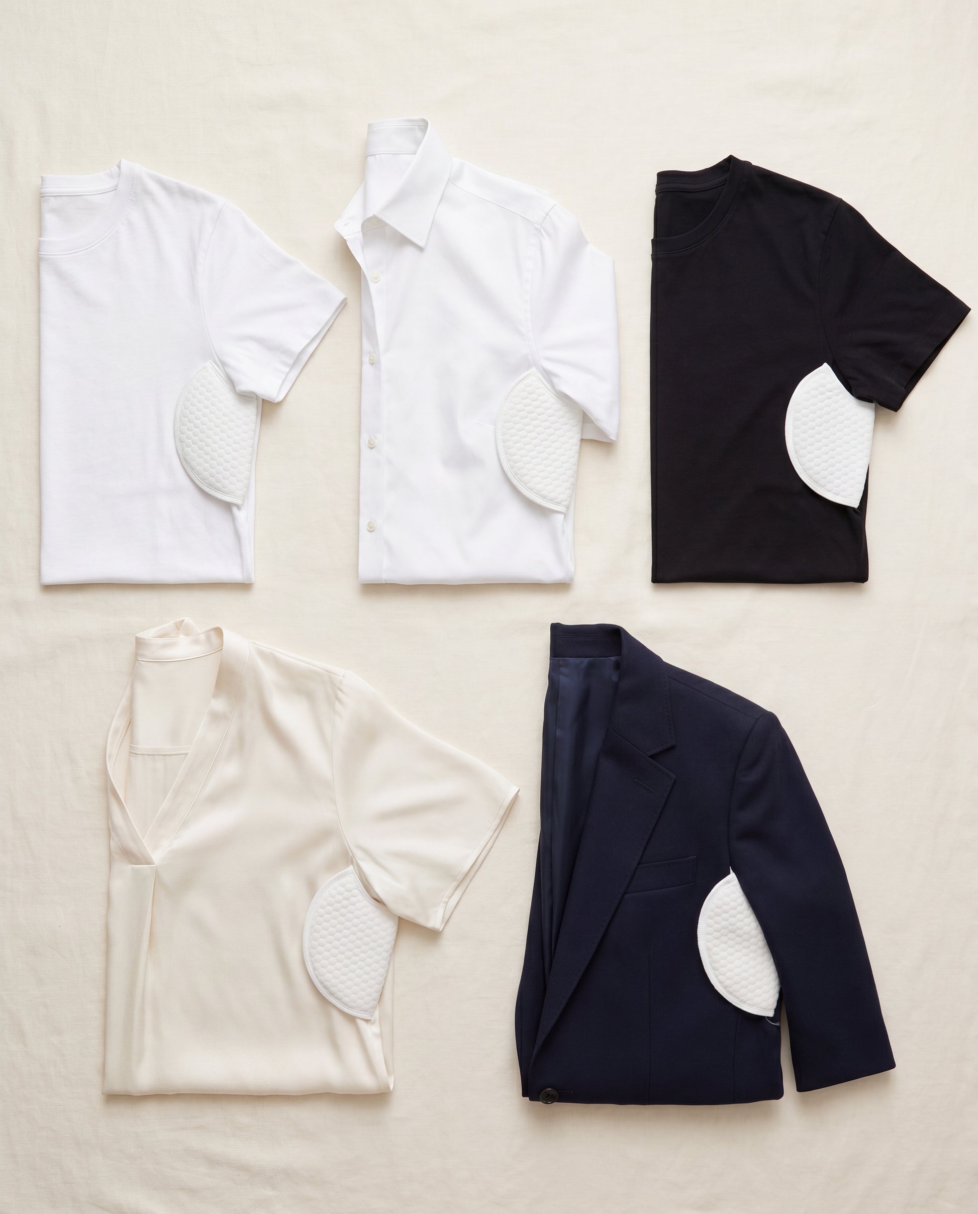 Sweat pads in five different shirts — variety flat-lay